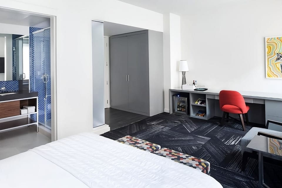 Settle in with a spacious layout, desk nook, and minibar.