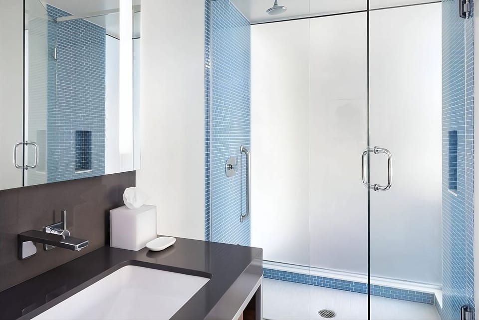 Refresh in a sleek glass shower with spa-bright finishes.