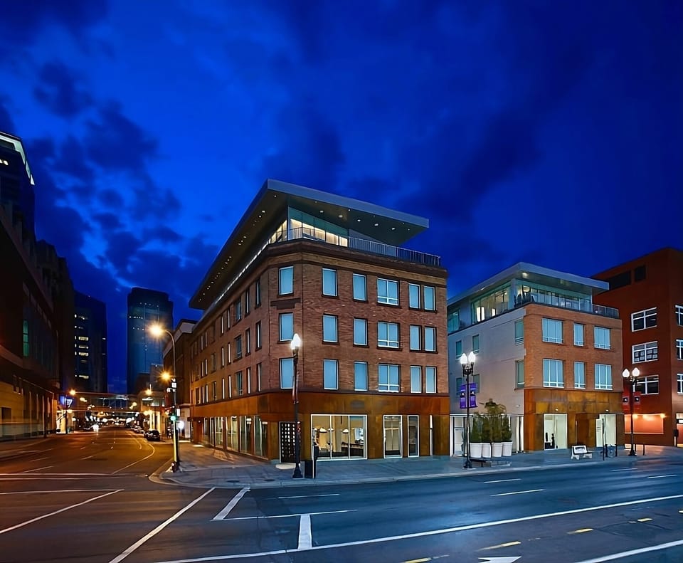 Picture evening walks on a bright, lively downtown block.