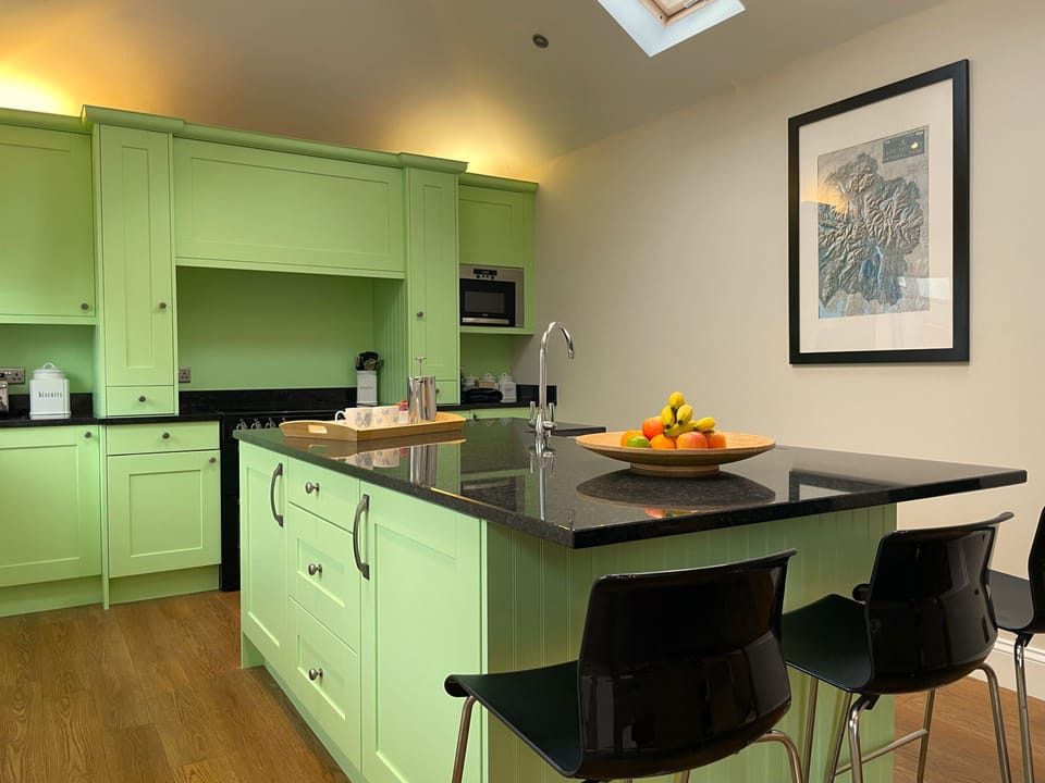 The bright airy kitchen is a lovely place to sit and enjoy your meals