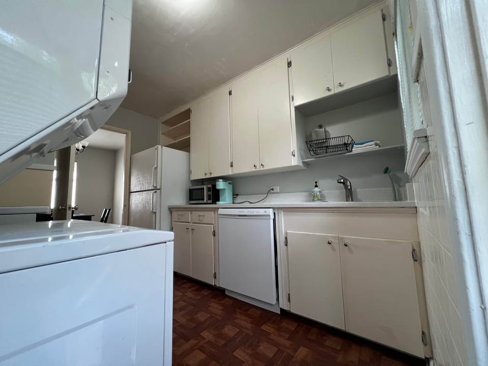 Newly renovated kitchen featuring quartz countertops, a sleek stainless steel sink, and a dishwasher, completed in August 2026.