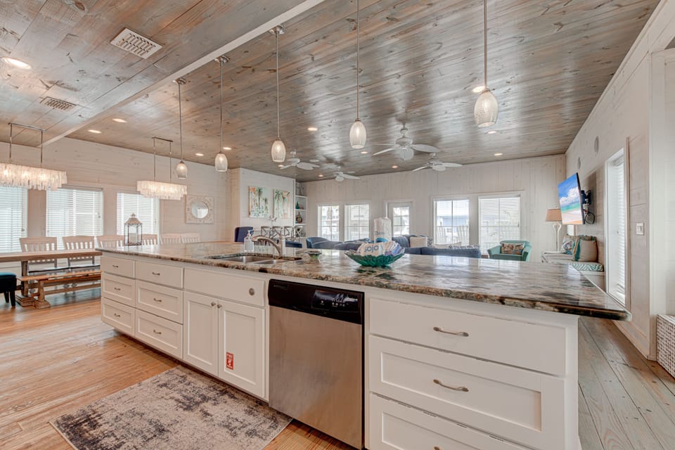 Your spacious open kitchen flows seamlessly into the living area, perfect for gathering with loved ones while you cook and create memories together.