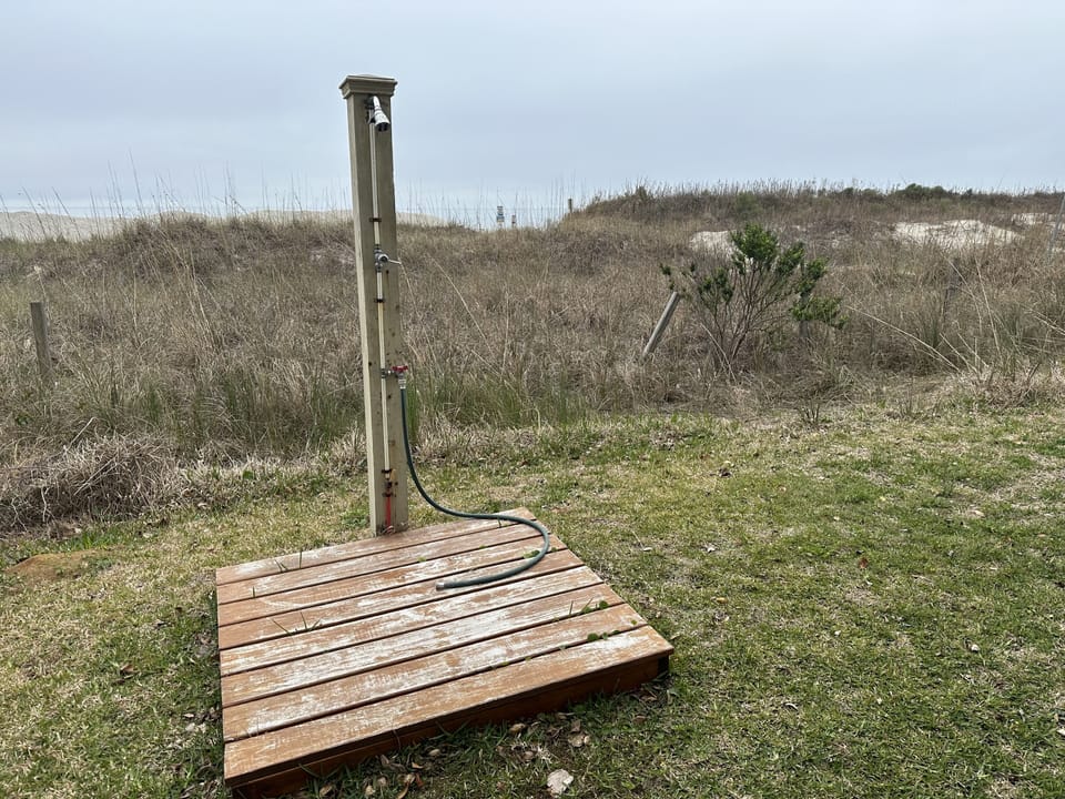 Freshwater outdoor shower to rinse yourself off on the way back from the beach!