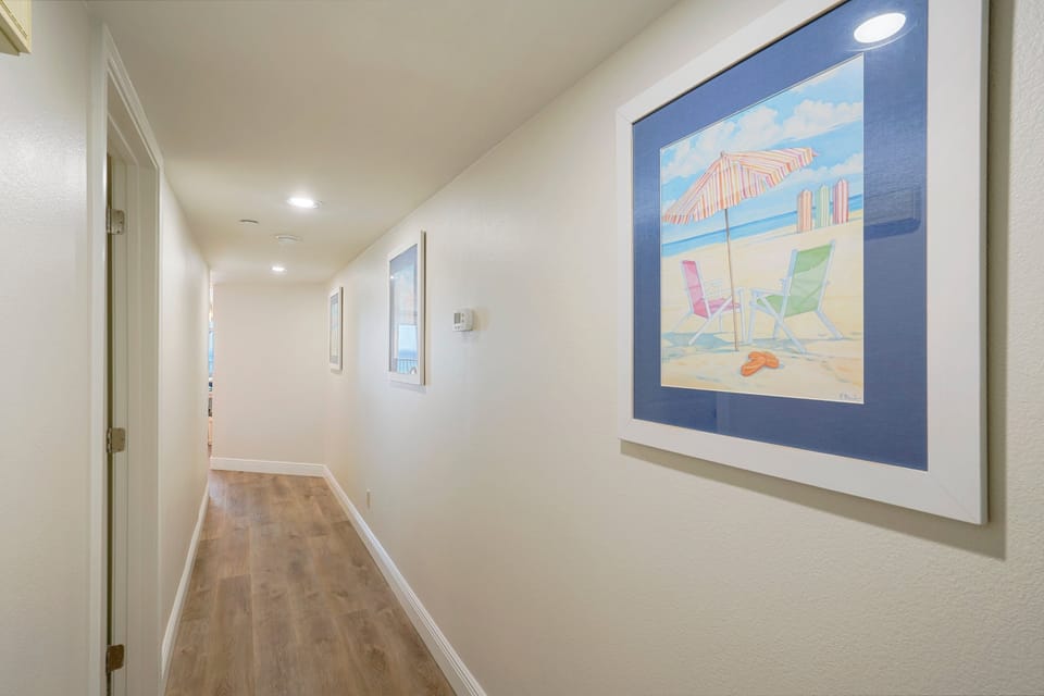 Bright entry way with clean lines and coastal art welcomes you to Cabana Club 307