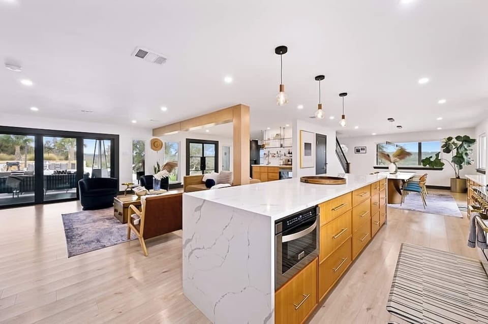 Home chefs will enjoy cooking in the spacious modern kitchen with high-end appliances and plenty of counter space.