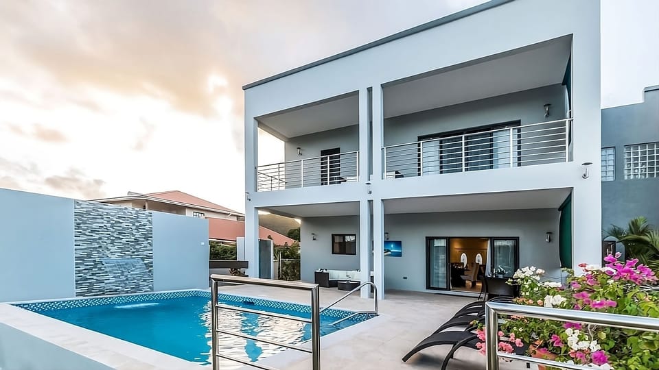 Dive into sparkling pool days beside breezy modern terraces.