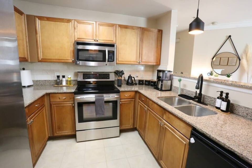 Cook with ease in our fully equipped kitchen, featuring stainless steel appliances, granite countertops, and all the essentials—including a coffee maker to jumpstart your mornings.