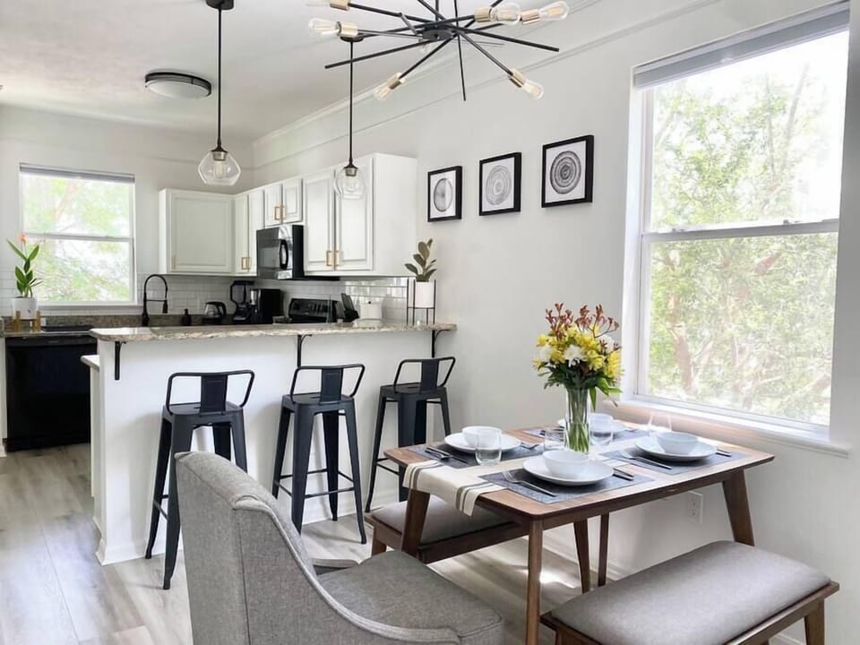 Gather for meals at this open dining space with plenty of natural light and easy access to the kitchen.