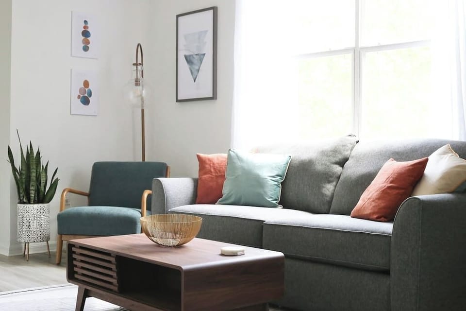 Cozy up in the bright and modern living room, complete with comfy seating, stylish decor, and plenty of natural light.