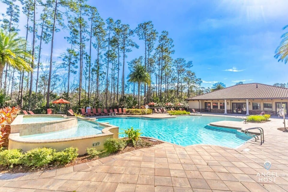 The clubhouse has pools with sun loungers for guests to enjoy.