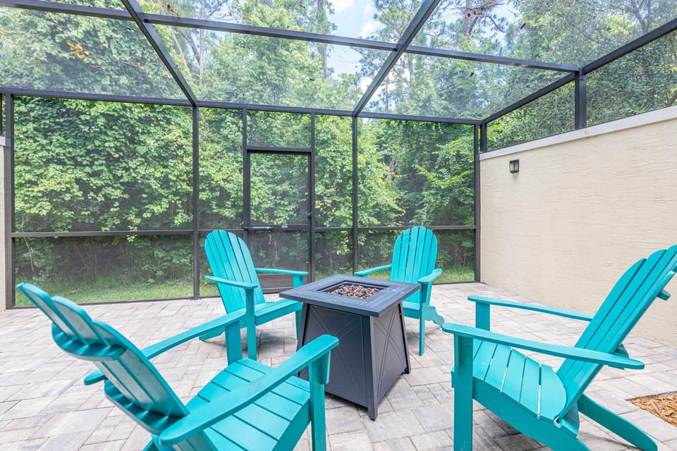 The private outside patio with 4 Adirondack chairs.
