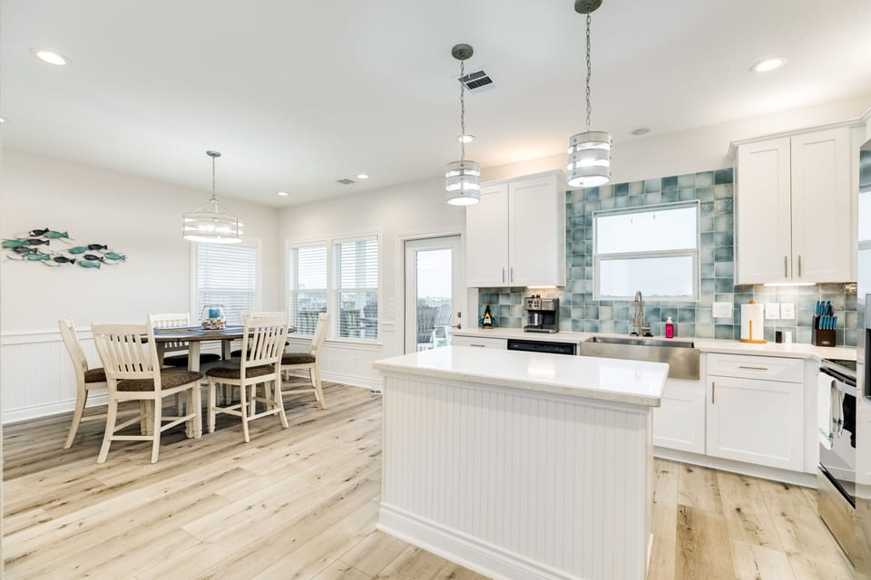 Open kitchen and dining area with deck access