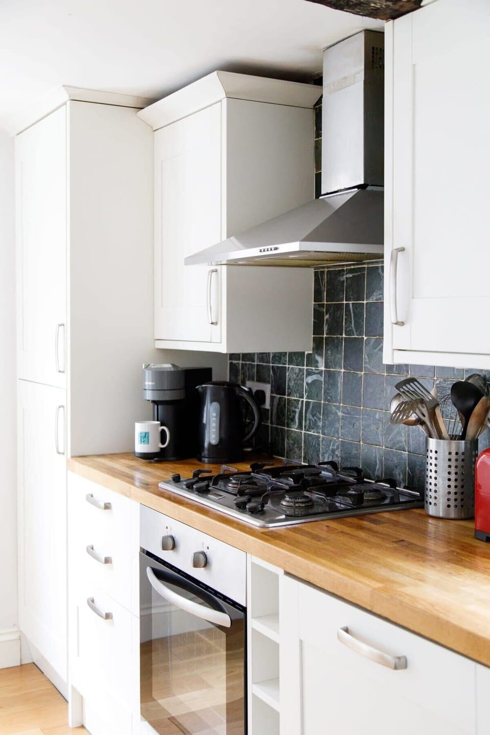 There is an oven, 4 gas rings, toaster, kettle and coffee machine.