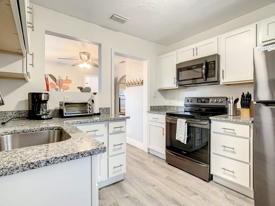 Kitchen with full range and full refrigerator