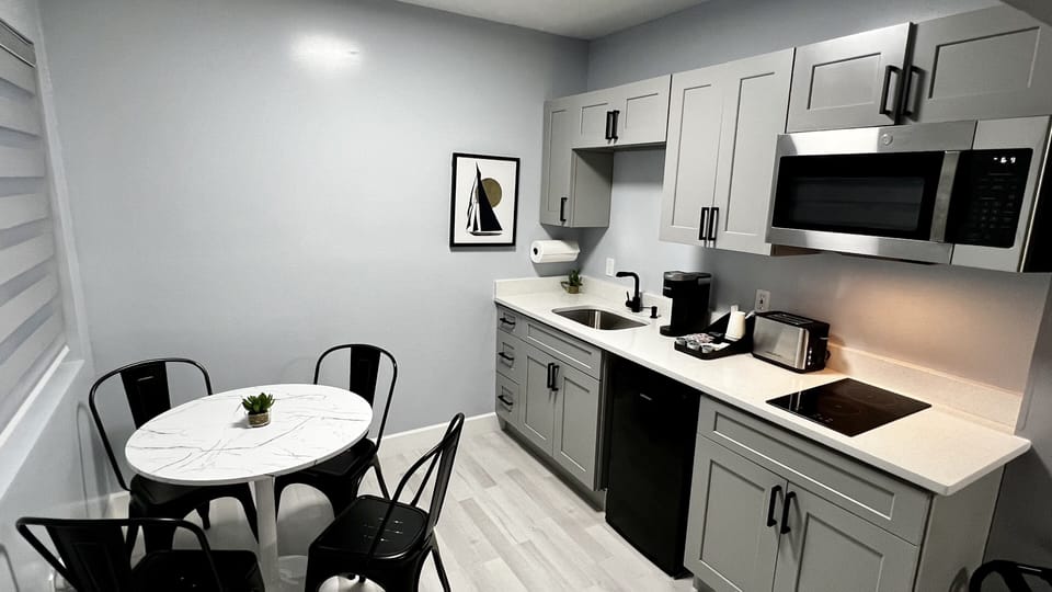 Kitchenette is equipped with mini fridge, microwave, toaster, coffee machine