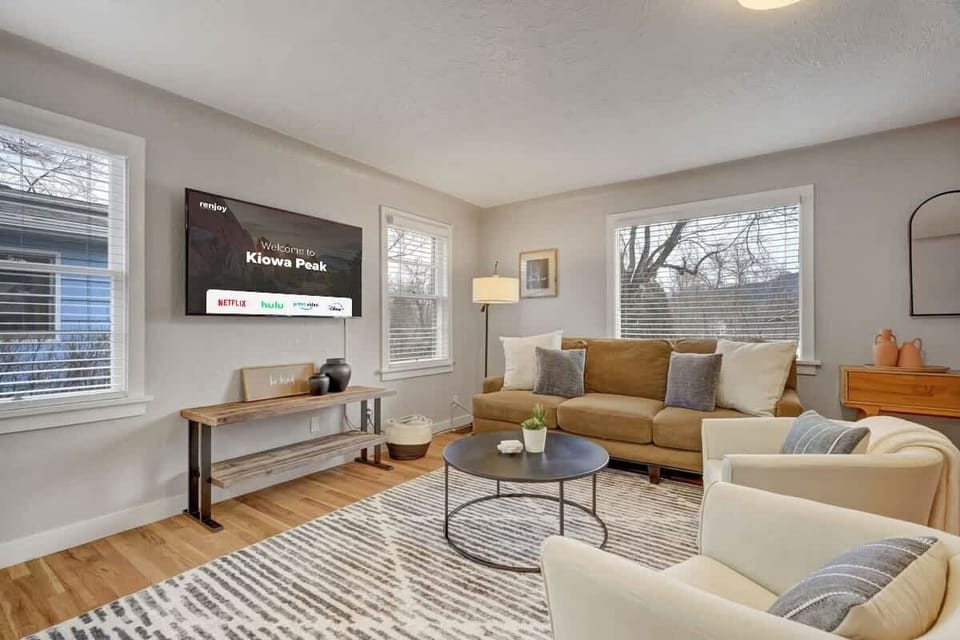 Catch up on all of your favorite TV shows and movies on the big screen smart TV in the comfy living room