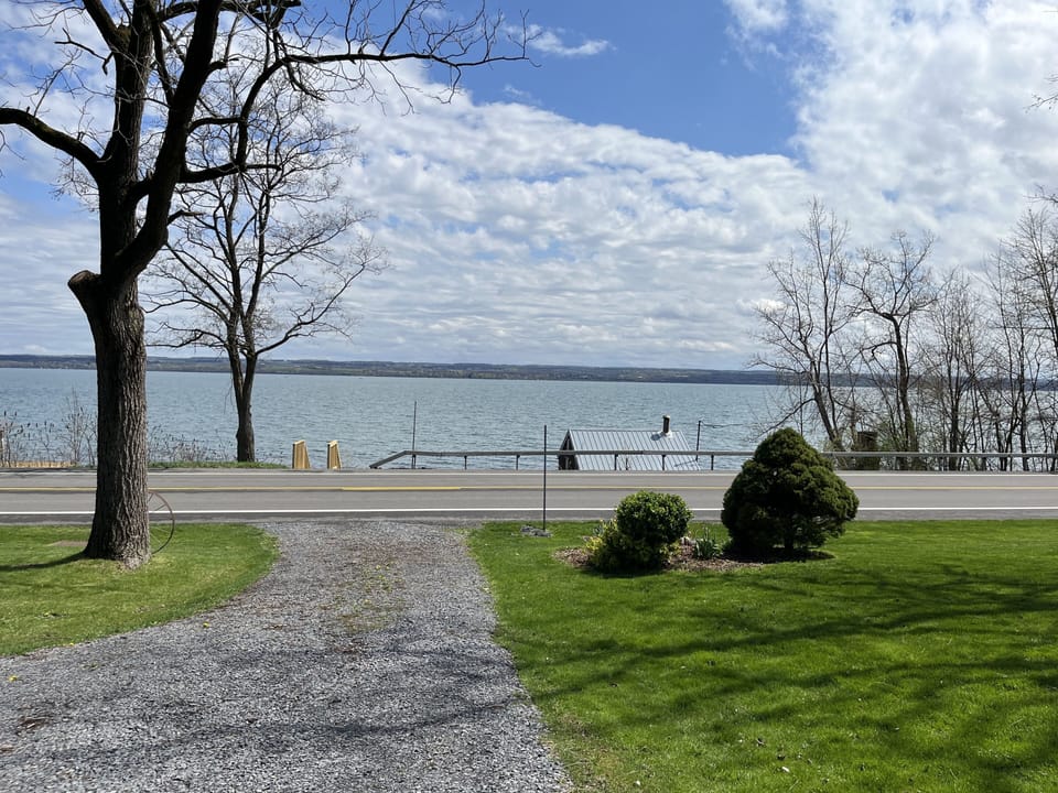 Scene of the lake with house at your back
