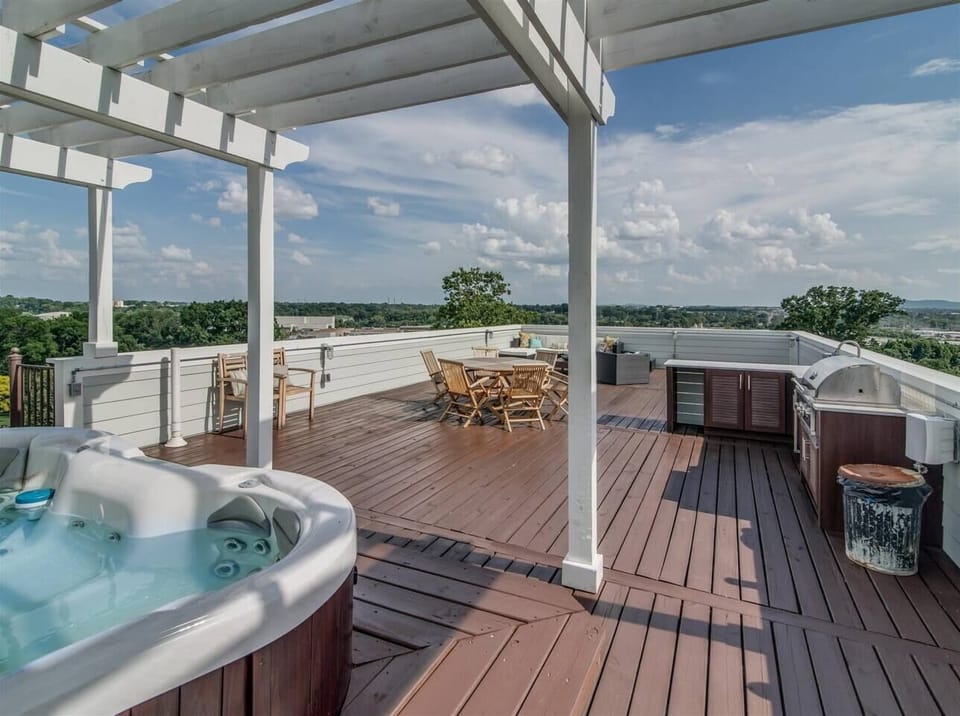 - Spacious rooftop with hot tub outdoor dining and wide views   - Bright open layout perfect for relaxation and fresh air time   - A great spot for meals soaking and enjoying sunny mornings