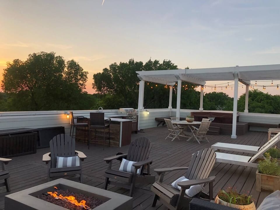 - Rooftop deck with fire pit lounge seating and evening lighting   - Open sky views create a relaxing space for outdoor gatherings   - Ideal place for sunsets casual chats and cozy nights