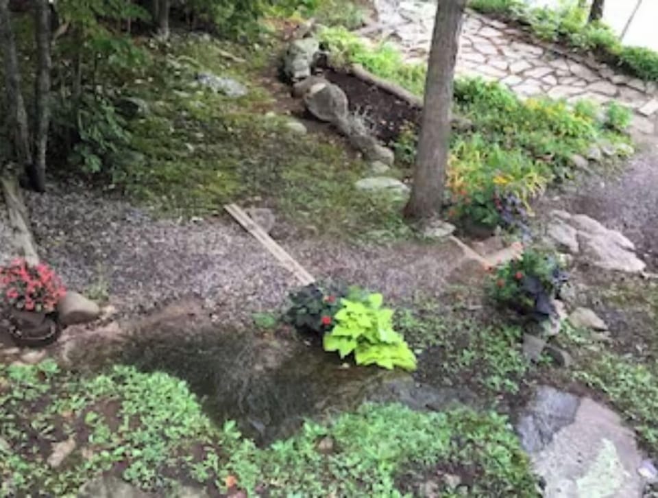continuation of the gravel steps to the dock, fire pit and flagstone patio.