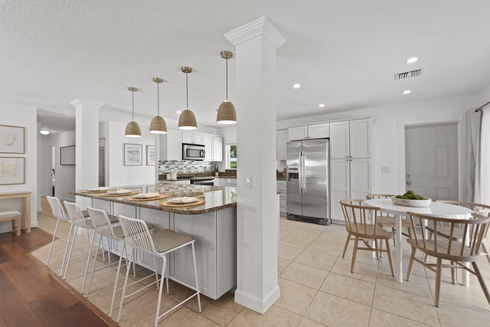 With the spacious kitchen and dining area, there is plenty seating for 8 guests.