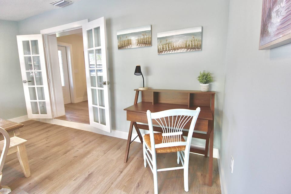 The corner desk and chair is the perfect spot for business travelers or students.