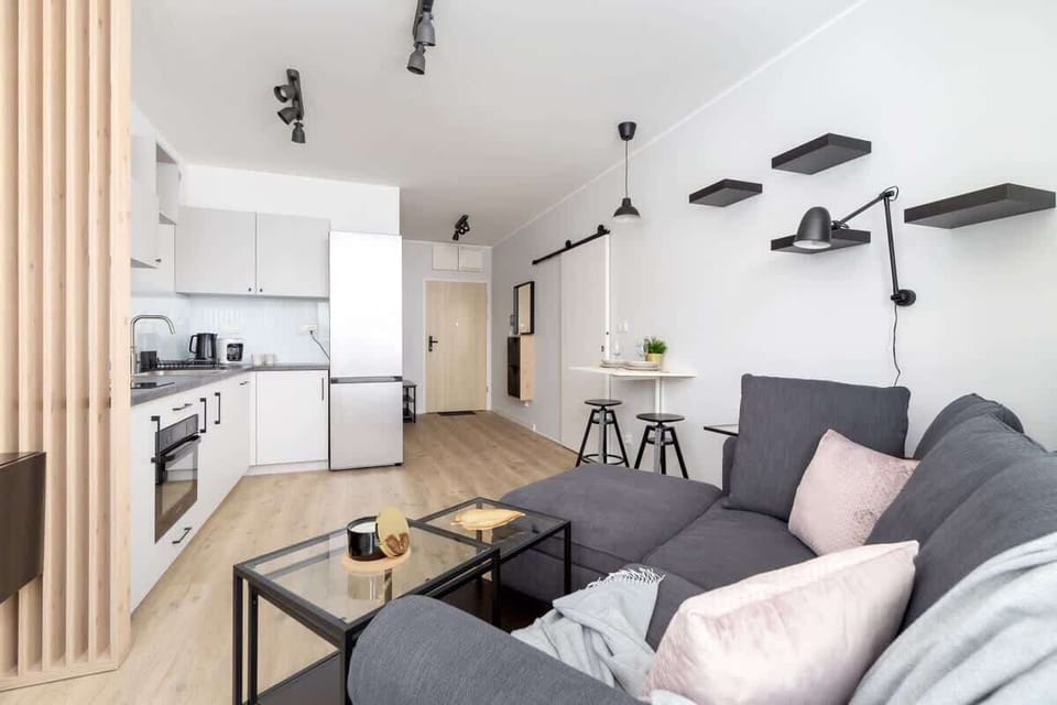 An open-concept kitchen and living room with stylish decor.
