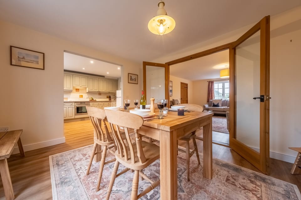 Ground floor: Dining room with a dining table seating four
