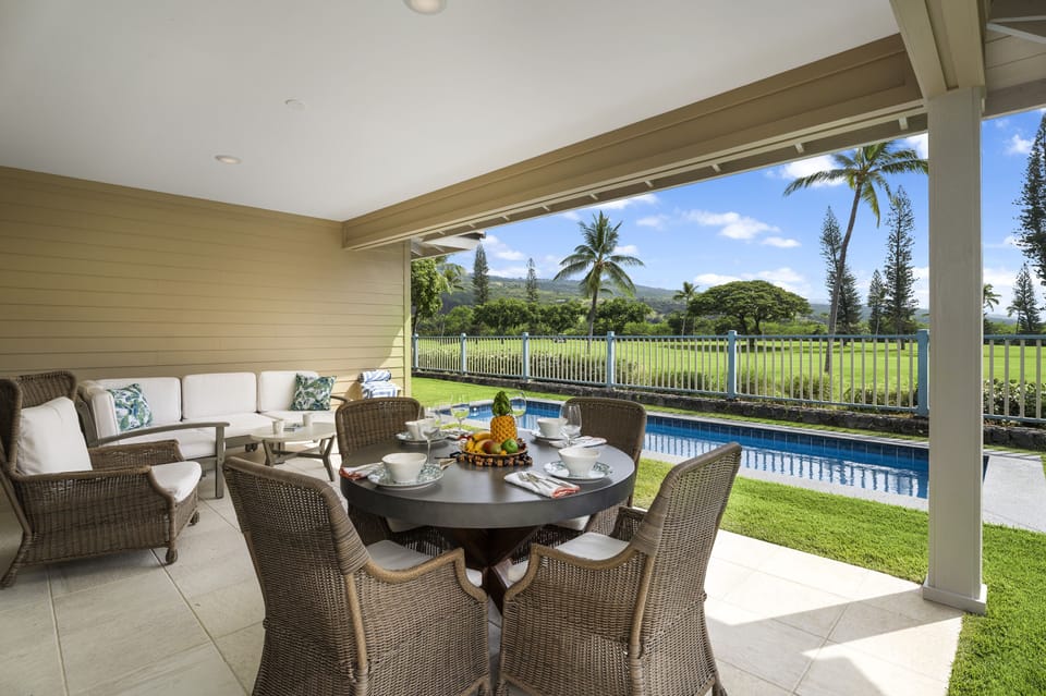 Outdoor dining area with golf course views, perfect for relaxed island meals.