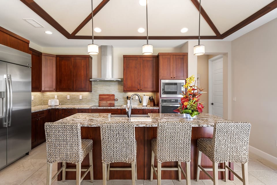 Large kitchen island with bar seating, ideal for casual meals and gathering.