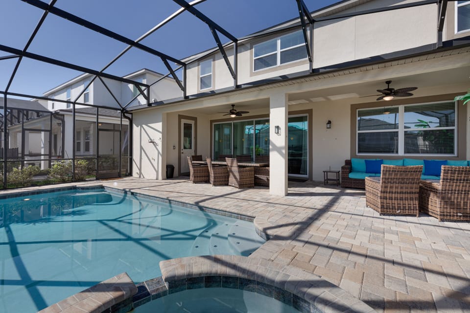 Your backyard has a spacious covered area with comfy chairs and sofas.