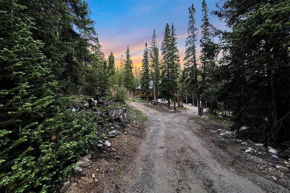 The cabin is located on a private drive and cul-de-sac surrounded by trees