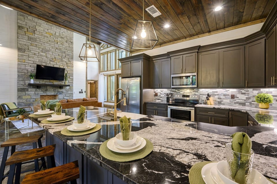 Spacious island with farmhouse sink — enjoy open views of the dining and living areas while cooking and connecting.
