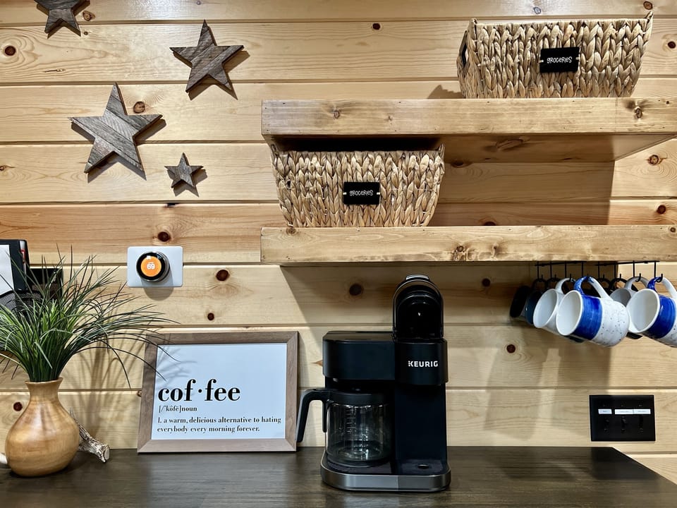 Dual coffee maker,  sugars and creamer provided for guest.
