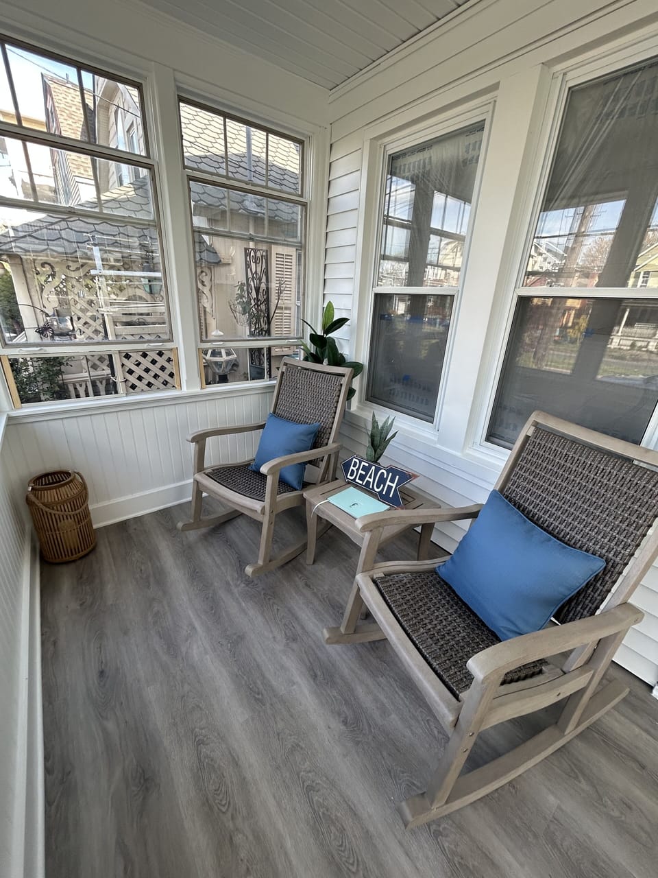 Enclosed front porch with heater, blue tooth speaker, fan and shades for privacy