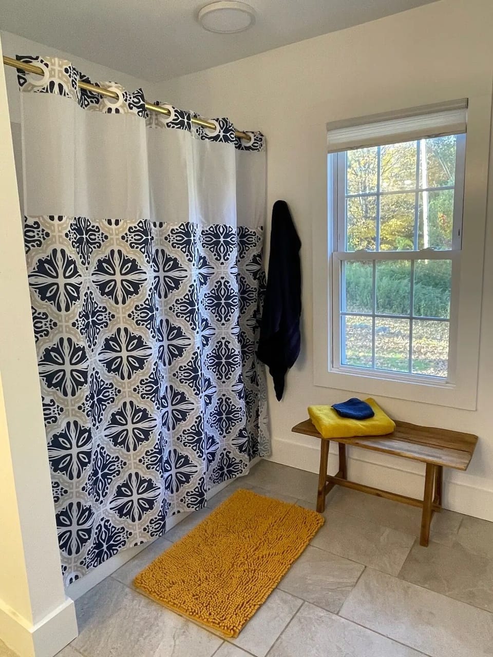 Main floor large bathroom has shower/tub as well as a separate stall shower.