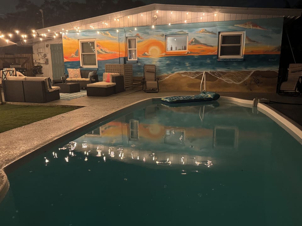 Enjoy the evening under twinkle lights. Music, food, fire and night swimming.