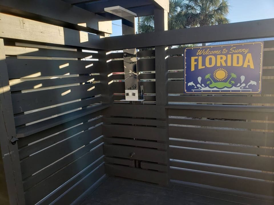 Outdoor Shower & Water Hose at front entrance to wash off sand before entering.