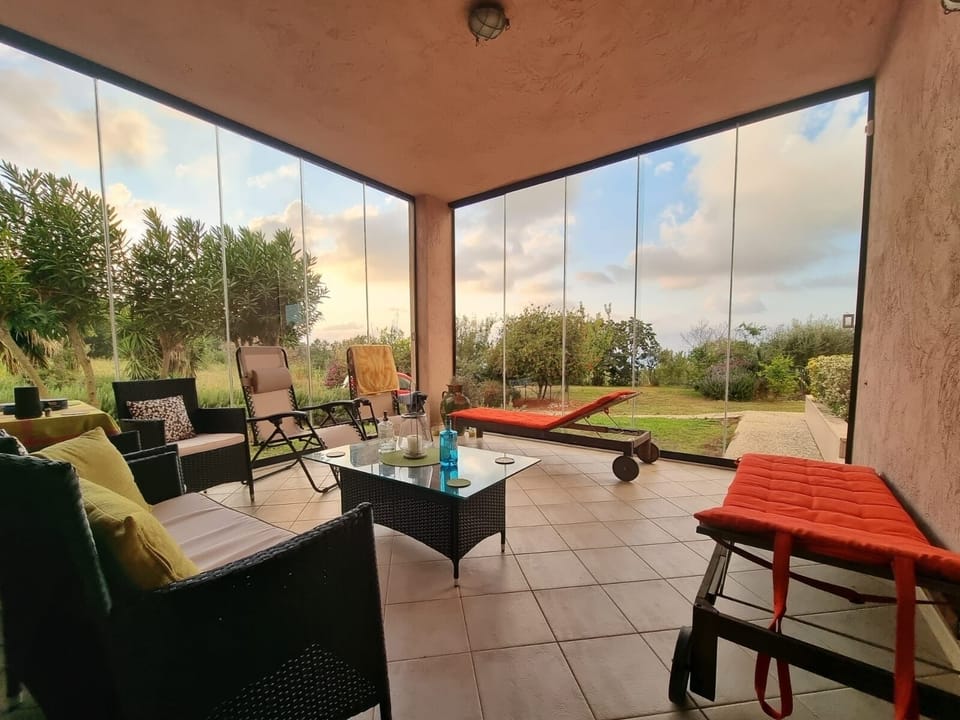 Glassed in veranda. Sliding glass doors can be opened for air & sunbathing. 