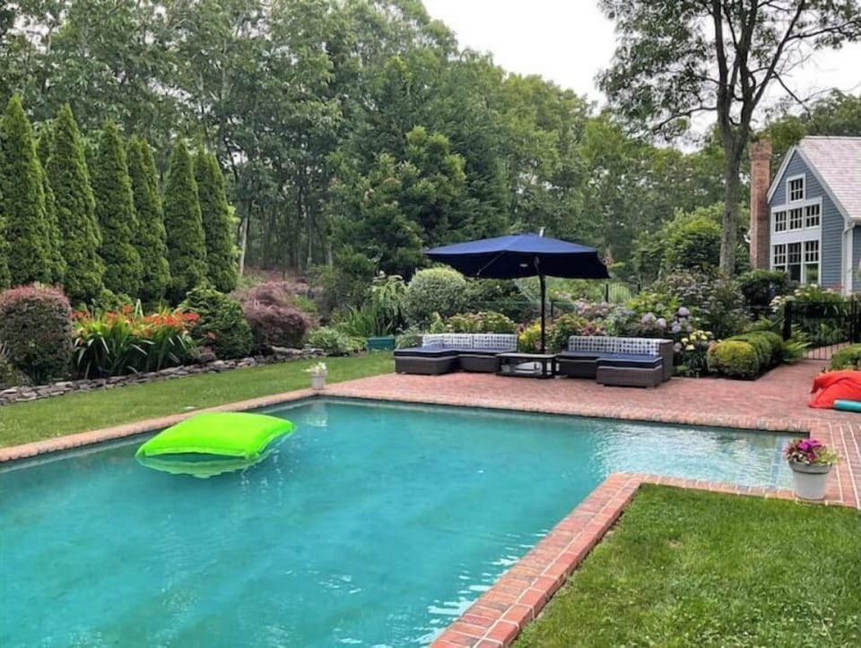Pool 20 x 40 heated pool with lounge chairs and sectional