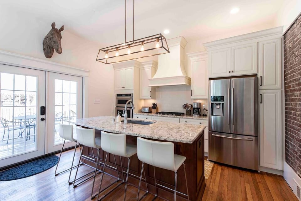 Gourmet Kitchen, top of the line appliances, all dishes, glassware, utensils included, attached to back deck
