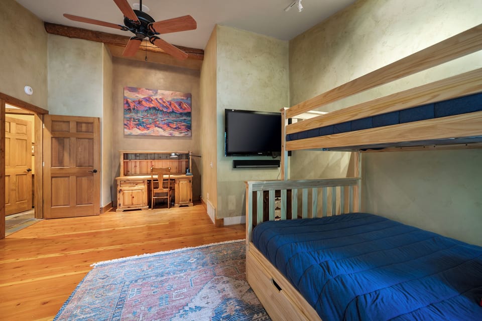 Relax in bed and watch a movie |  Bunk bed with Full sized on bottom and Twin sized bed on top
