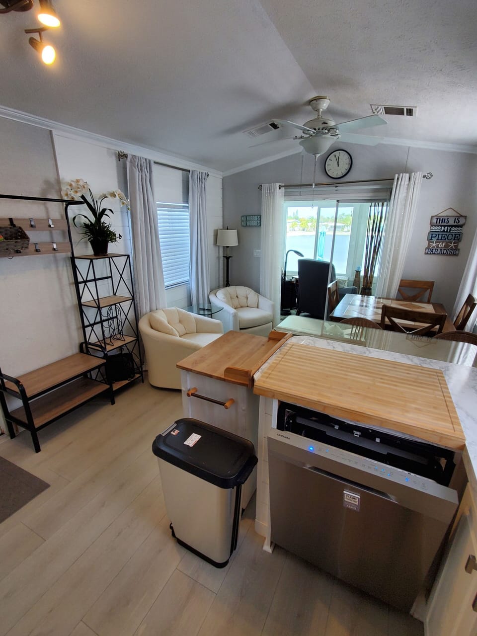 Dishwasher, full size. White cart rolls over for more cooking prep space.