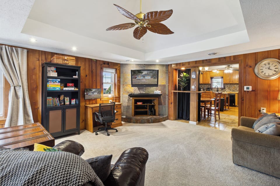Nice size living room with room dividing and darkening curtain.