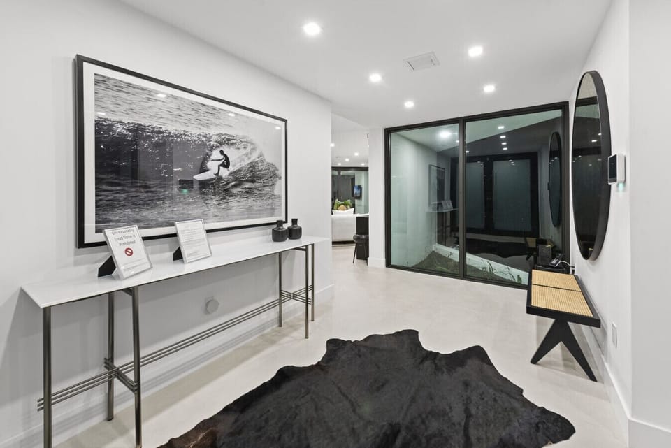 Elegant sleeping space with contemporary furnishings and breathtaking water views