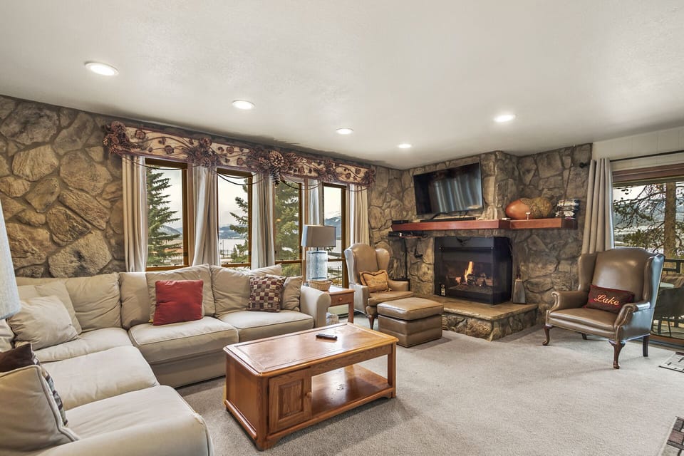 Relax in our cozy Living Room with fireplace and beautiful views of Lake Dillon
