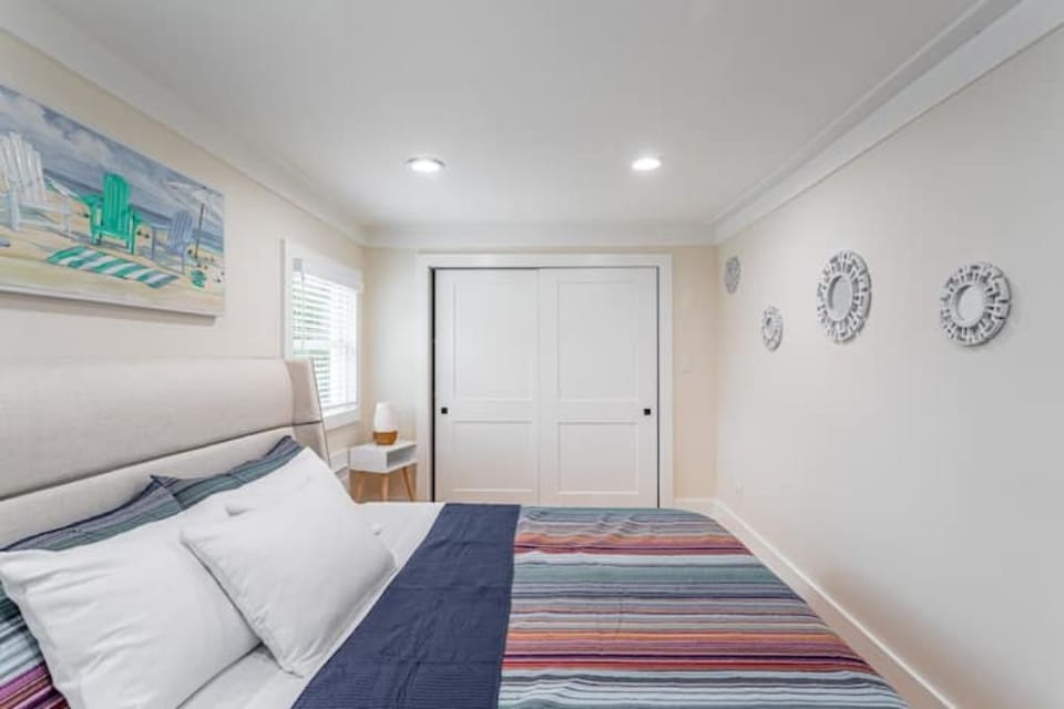 Bedroom two is filled with a comfortable king bed