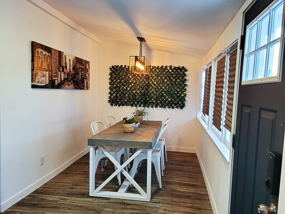 Dining area with lots of natural lighting. Great for meals or to use as a more private work space!