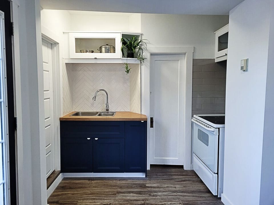 New and clean kitchen area. Stocked with pots, pans, dish soap, cutlery, cooking utensils, etc.
