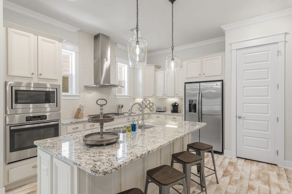 Fully stocked kitchen with cookware, serveware, utensils, plates, bowls, cups and more!